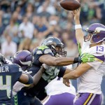 The Associated Press Minnesota Vikings quarterback Shaun Hill, right, is pressured by Seattle Seahawks outside linebacker K.J. Wright, center, and middle linebacker Bobby Wagner (54).