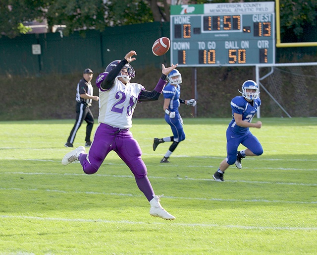 Steve Mullensky/for Peninsula Daily News Sequim&rsquo;s Rudy Whitehead attempts to corral a pass during a 2015 game against Chimacum.