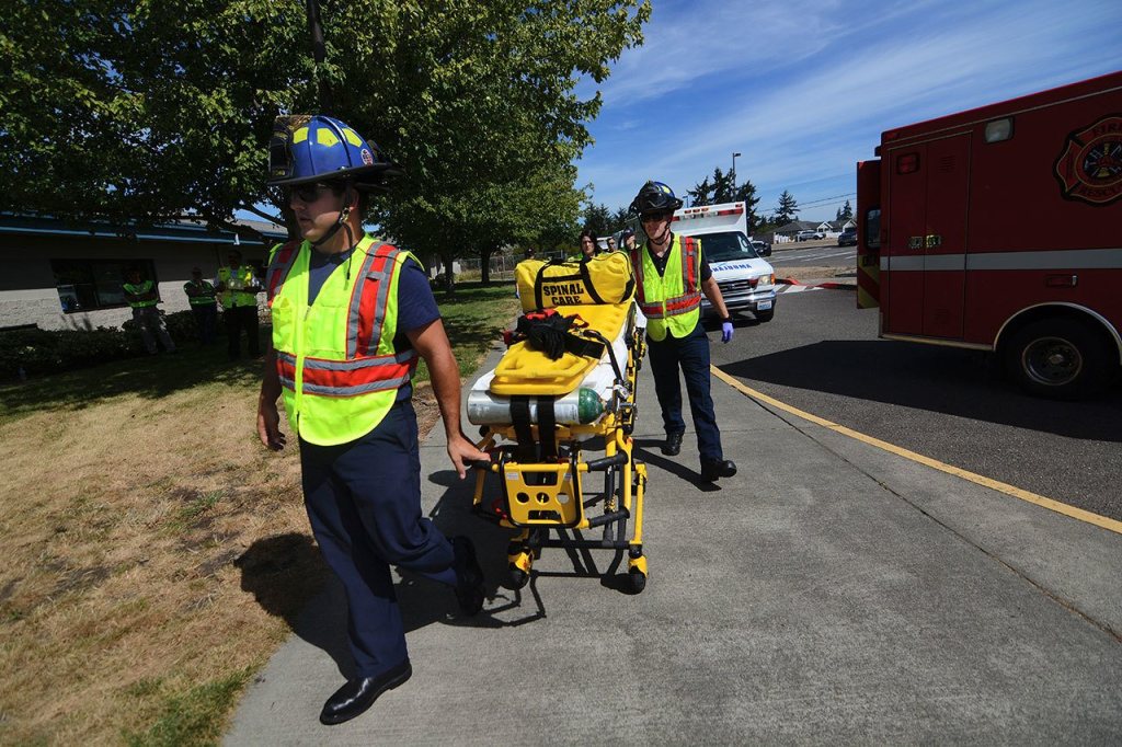 Paramedics respond to a mass shooting drill at Greywolf Elementary School in Carlsborg on Friday. (Jesse Major/Peninsula Daily News)