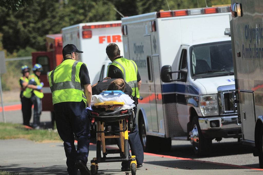 Paramedics respond to a mass shooting drill at Greywolf Elementary School in Carlsborg on Friday. (Jesse Major/Peninsula Daily News)