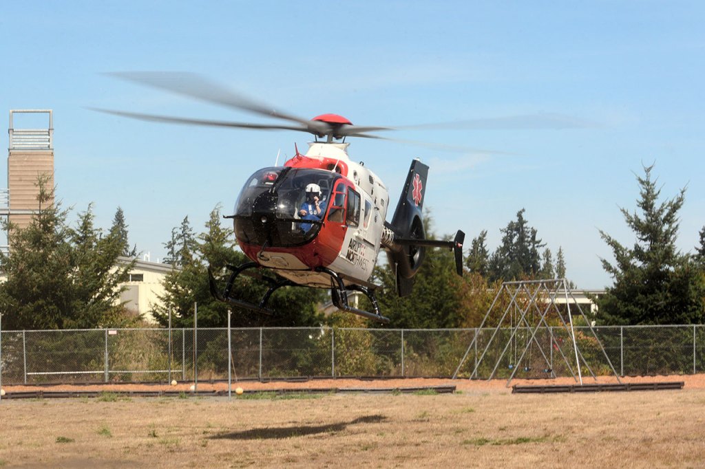 Airlift Northwest lands at Greywolf Elementary School after a mass shooting drill Friday. (Jesse Major/Peninsula Daily News)