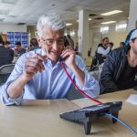 Bill Bryant, Republican candidate for Washington governor, phones potential voters and requests they submit their primary ballots Tuesday at his campaign headquarters in Seattle&rsquo;s Sodo neighborhood. (Steve Ringman/The Seattle Times via AP)