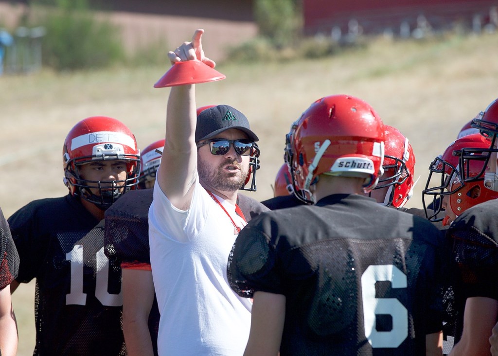 Steve Mullensky/for Peninsula Daily News                                New Port Townsend Redhawks head coach Alex Heilig instructs his players at a preseason practice.