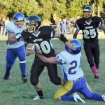 Lonnie Archibald/for Peninsula Daily News Clallam Bay&rsquo;s Clayton Willis fights for yardage during a 2015 game against Crescent. The Bruins are low on numbers and scrambling to salvage a season this fall.