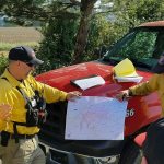 Clallam County Fire District No. 2 firefighters receive a briefing on their shift assignment at the Yale Road Fire southeast of Spokane. (Steve Bentley/Clallam County Fire District No. 2)