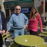 Mari Mullen, left, director of the Port Townsend Main Street Program, stands with Coldwell Broker employees Forrest Aldrich, the designated broker, and Belinda Button, the office manager, in the new seating area on Taylor Street in downtown Port Townsend. (Cydney McFarland/Peninsula Daily News)