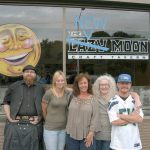New Moon Craft Tavern staffers Brian Crocker, Becky Nelson, Debby Cargo, Marie McKean and Todd Kain stand outside the former Lazy Moon Craft Tavern in Port Angeles. The bar opens under new ownership at 11:30 a.m. today. (Rob Ollikainen/Peninsula Daily News)