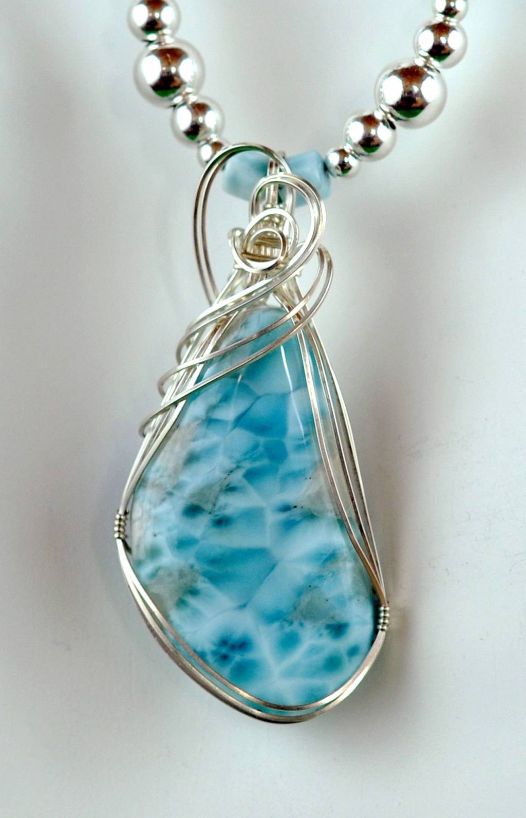 Jewelry by Paulette Hill.