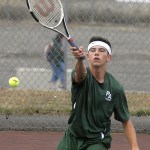 Keith Thorpe/Peninsula Daily News                                Port Angeles&rsquo; Kenny Soule hits the return in his match against Nick Etzell of Coupeville. Soule defeated Etzell in three sets and earned the team ball for his play.