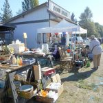 Shoppers look for bargains at last year&rsquo;s Great Strait Sale on state Highway 112 in Joyce. Despite a detour for culvert work in Pysht, organizers said the annual event will go on in many towns, including Joyce, Clallam Bay, Sekiu and Neah Bay. (Sande Balch)