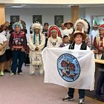 Lower Elwha Tribal Chairwoman Frances Charles displays the tribe&rsquo;s flag in a presentation to the Standing Rock Sioux on Aug. 29. (Lower Elwha Tribe)