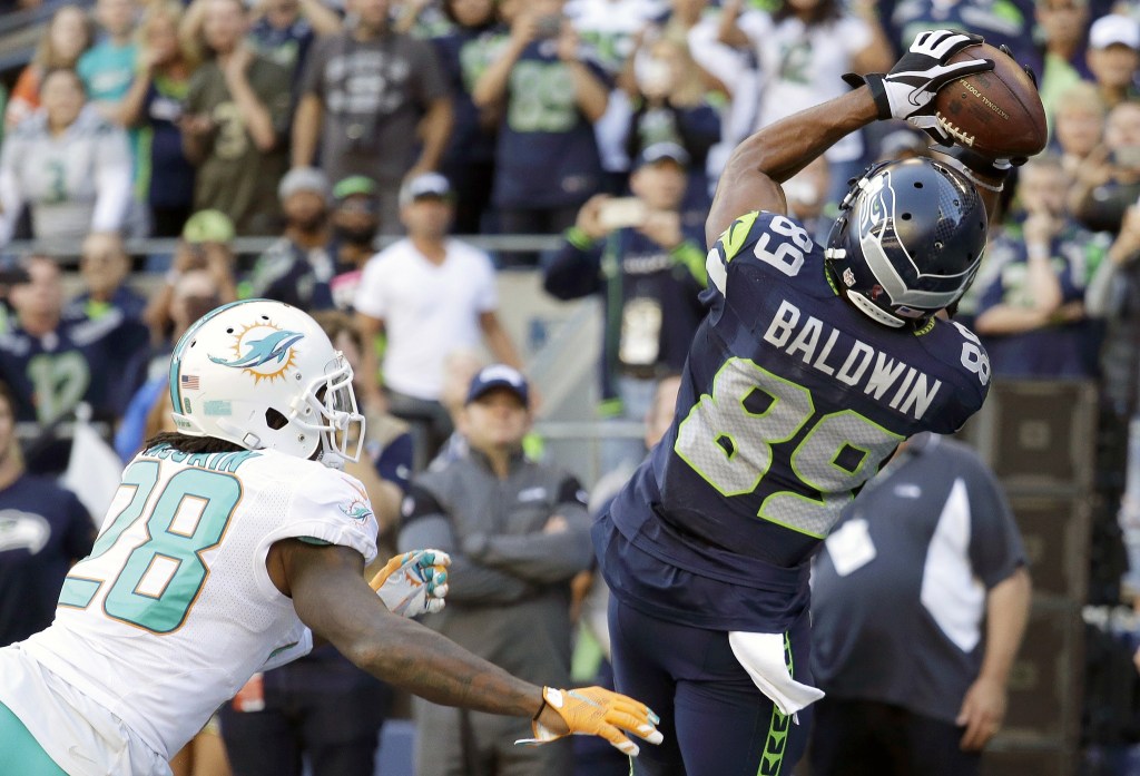 The Associated Press                                Seattle&rsquo;s Doug Baldwin (89) catches a pass for a touchdown over Miami&rsquo;s Bobby McCain with 31 seconds left to give the Seahawks a 12-10 win over the Dolphins.