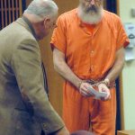 Douglas Allison, right, is ushered to his chair by Clallam County public defender Harry Gasnick during Allison&rsquo;s sentence hearing Wednesday in Clallam County Superior Court in Port Angeles. (Keith Thorpe/Peninsula Daily News)
