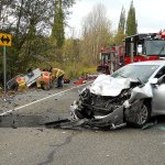 Medic units from Port Ludlow Fire & Rescue and East Jefferson Fire-Rescue respond to a two-vehicle accident at the intersection of state Highway 19 and Oak Bay Road on Friday. (Port Ludlow Fire & Rescue)