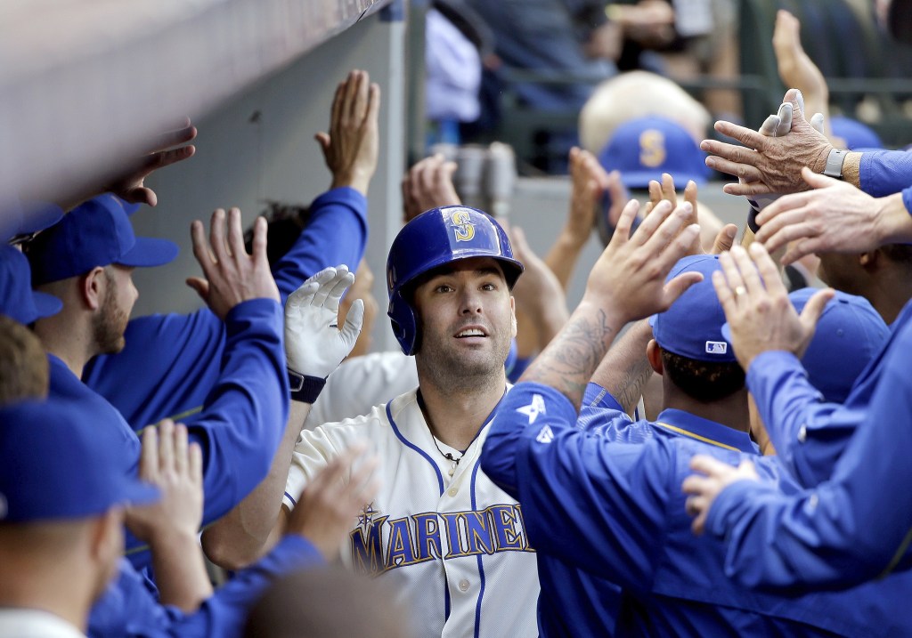 The Associated Press                                Seattle&rsquo;s Seth Smith is greeted in the dugout after his three-run home run against Houston on Sunday in Seattle.