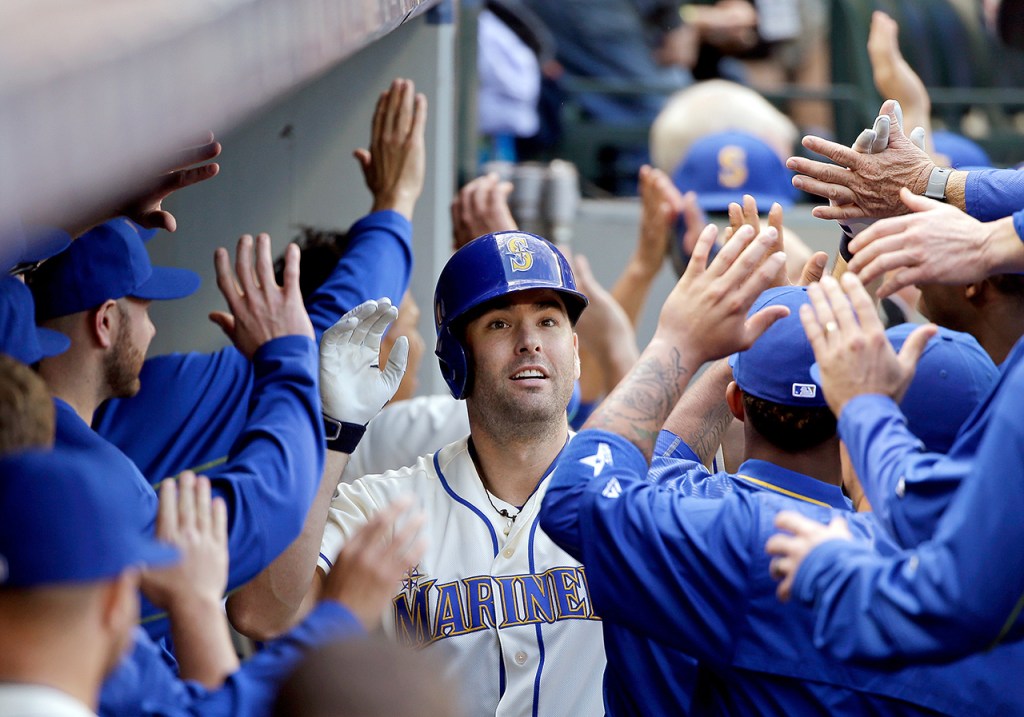 Seattle Mariners&rsquo; Seth Smith is greeted in the dugout after his three-run home run against the Houston Astros in the fourth inning of a baseball game Sunday, Sept. 18, 2016, in Seattle. (AP Photo/Elaine Thompson)