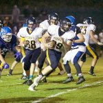 Steve Mullensky/for Peninsula Daily News                                Forks&rsquo; Jack Dahlgren (99) runs for a 30-yard gain in the Spartans 48-7 win over Chimacum last Friday in Port Townsend.