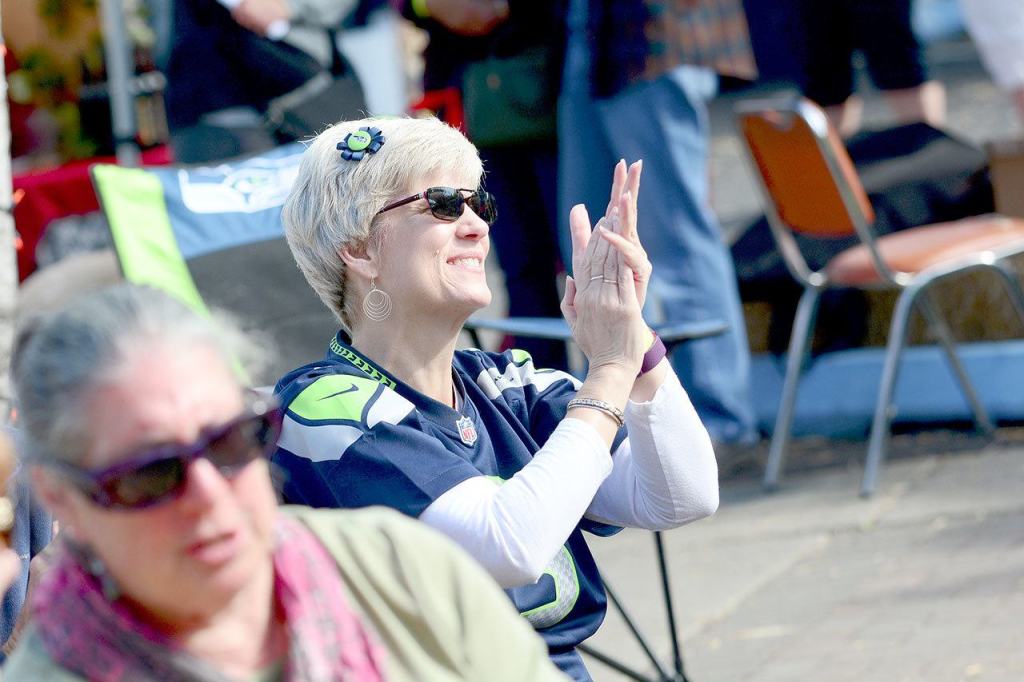 Christine Paulsen of Port Angeles cheers at Arts and Draughts in downtown Port Angeles while watching Sunday&rsquo;s Seahawks game against the 49ers. (Jesse Major/Peninsula Daily News)