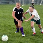 David Logan/Peninsula Daily News                                Sequim&rsquo;s Chloe Sparks, left, and Port Angeles&rsquo; Emily Boyd jostle for the ball during their rivalry match at Civic Field in Port Angeles. Sequim won 3-1 in a penalty kick shootout.