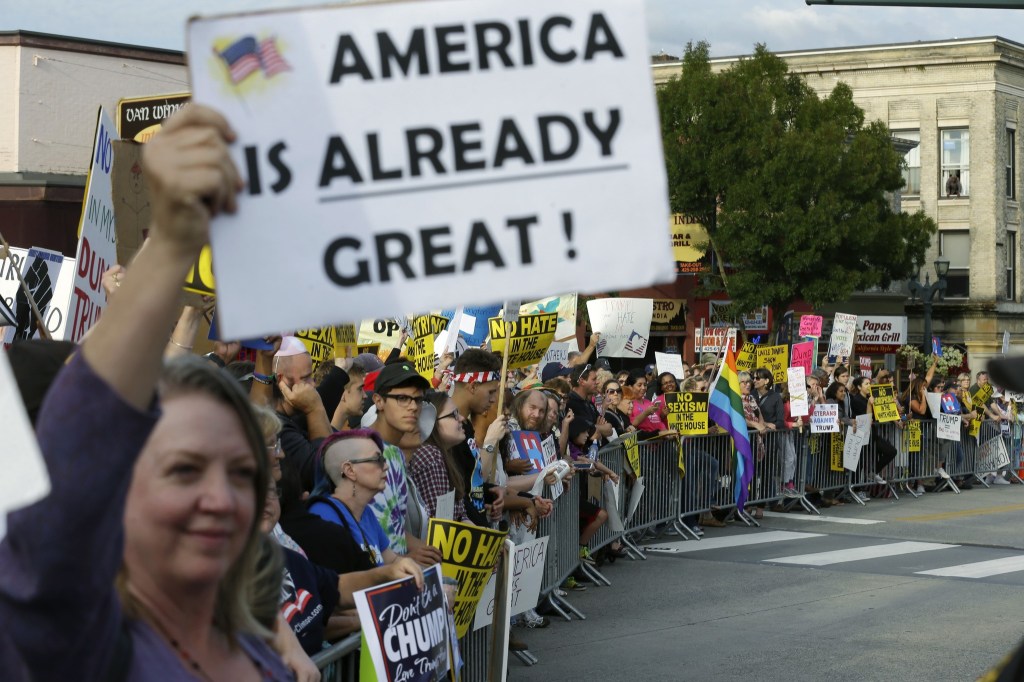 Protesters line a barricade outside a rally for Republican presidential candidate Donald Trump on Tuesday in Everett. (Ted S. Warren/The Associated Press)
