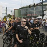 Seattle police officers stand watch near protesters outside a rally for Republican presidential candidate Donald Trump in Everett. (Ted S. Warren/The Associated Press)