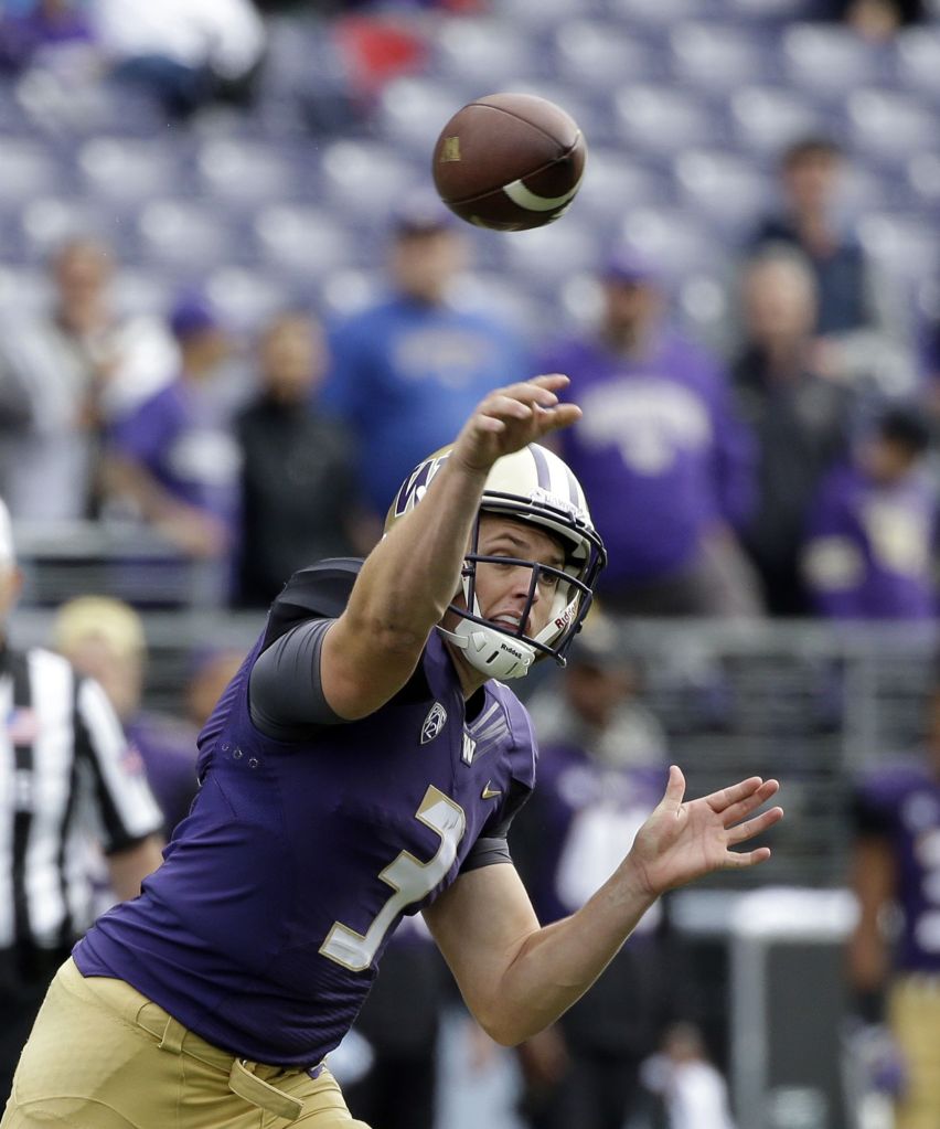 Washington quarterback Jake Browning passes against Rutgers in the first half of an NCAA college football game, Saturday, Sept. 3, 2016, in Seattle. (AP Photo/Elaine Thompson)
