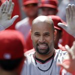 Los Angeles Angels&rsquo; Albert Pujols is congratulated on his home run against the Seattle Mariners in the first inning of a baseball game Sunday, Sept. 4, 2016, in Seattle. (AP Photo/Elaine Thompson)