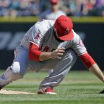 Los Angeles Angels starting pitcher Matt Shoemaker collapses onto the field after being hit by a line drive from Seattle Mariners&rsquo; Kyle Seager in the second inning of a baseball game, Sunday, Sept. 4, 2016, in Seattle. Shoemaker left the game. (AP Photo/Elaine Thompson)