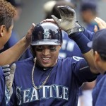 Seattle Mariners&rsquo; Leonys Martin is congratulated by teammates after scoring against the Texas Rangers during the sixth inning of a baseball game Monday, Sept. 5, 2016, in Seattle. (AP Photo/Elaine Thompson)