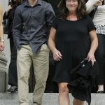 Stephanie McCleary and her son Carter McCleary, 17, walk out of the Temple of Justice on Wednesday in Olympia. (Ted S. Warren/The Associated Press)