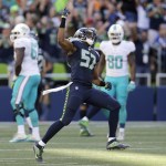 Seattle Seahawks outside linebacker Mike Morgan (57) celebrates after teammate Cassius Marsh blocked a field goal-attempt by Miami Dolphins&rsquo; Andrew Franks in the second half of an NFL football game, Sunday, Sept. 11, 2016, in Seattle. (AP Photo/Stephen Brashear)