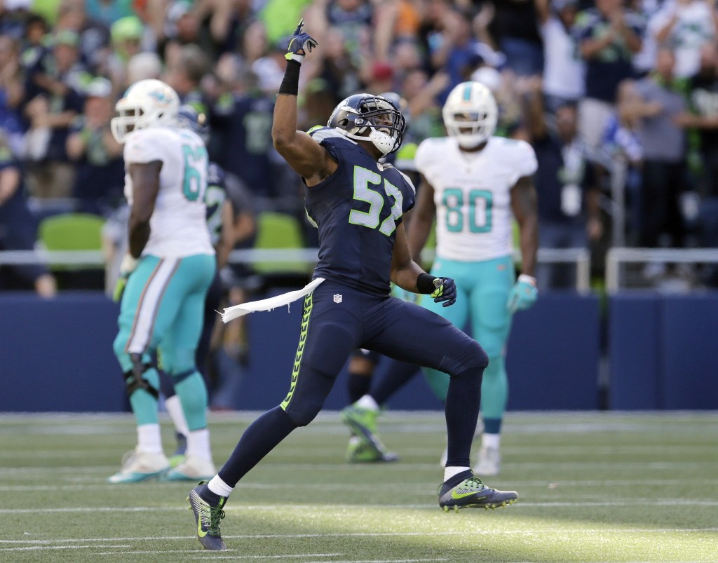 Seattle Seahawks outside linebacker Mike Morgan (57) celebrates after teammate Cassius Marsh blocked a field goal-attempt by Miami Dolphins&rsquo; Andrew Franks in the second half of an NFL football game, Sunday, Sept. 11, 2016, in Seattle. (AP Photo/Stephen Brashear)