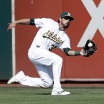 Oakland Athletics center fielder Brett Eibner makes a sliding catch on a fly ball from Seattle Mariners&rsquo; Dae-Ho Lee during the eighth inning of a baseball game, Sunday, Sept. 11, 2016, in Oakland, Calif. (AP Photo/Marcio Jose Sanchez)