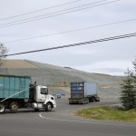 In this June 1 photo, trucks enter the LRI landfill in Graham. Washington state environmental regulators finalized a new rule Thursday to limit greenhouse gas emissions from large emitters, including the landfill. (Ted S. Warren/The Associated Press)