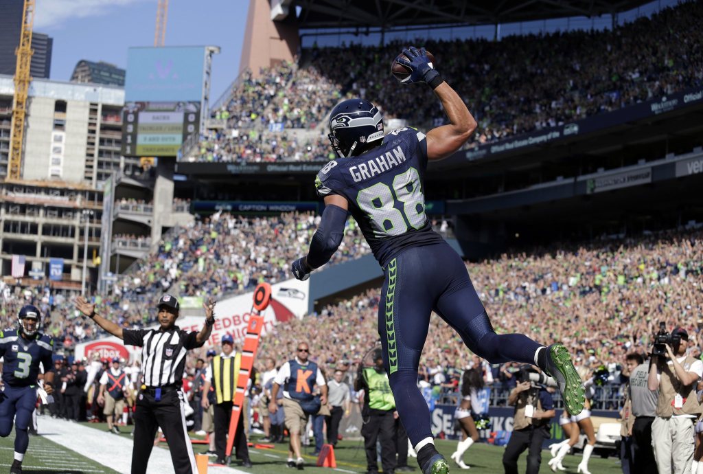 Seattle Seahawks&rsquo; Jimmy Graham (88) leaps in celebration after scoring a touchdown against the San Francisco 49ers in the first half of an NFL football game, Sunday, Sept. 25, 2016, in Seattle. (AP Photo/John Froschauer)