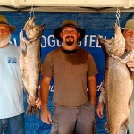 Mark Thompson, right, of Port Angeles, poses with the winning 32.4-pound king caught during the Restoring the Rogue Salmon Derby held last month on the Rogue River near Grants Pass, Ore. At far left is Thompson&rsquo;s teammate, high school classmate and fellow Marine, Carl Cole and guide Matt Judkins.