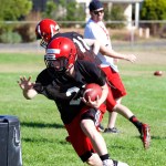 Steve Mullensky/for Peninsula Daily News Port Townsend&rsquo;s Kyle Blankenship runs with the ball during a preseason practice at Flint Field.