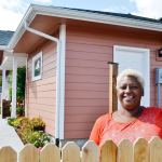 Eula Cook stands outside her new home in Port Angeles&rsquo; Maloney Heights Subdivision. After almost nine years in Sequim, she received assistance through Habitat for Humanity of Clallam County to purchase her own home. (Matthew Nash/Olympic Peninsula News Group)
