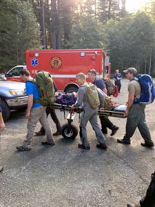Members of the Clallam County Search and Rescue team, Clallam County Fire District No. 3 and U.S.Border Patrol work together to bring an injured hiker off a trail. (Sgt. Lyman Moores/Clallam County Sheriff&rsquo;s Office)