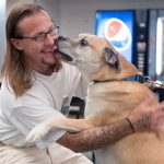 William Friedrichs with Connor, a boxer mix. (Brian Harmon)