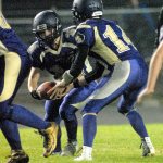 Keith Thorpe/Peninsula Daily News                                Sequim running back Tyler Conn takes the handoff from quarterback Riley Cowan in the first quarter of the Wolves&rsquo; 42-7 loss to North Kitsap.