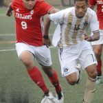 Keith Thorpe/Peninsula Daily News                                Everett&rsquo;s Victor Ramirez, left, tries to outrace Peninsula&rsquo;s Juan Carrillo during first-half play in the Pirates&rsquo; 6-1 win over the Trojans.