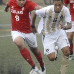 Keith Thorpe/Peninsula Daily News                                Everett&rsquo;s Victor Ramirez, left, tries to outrace Peninsula&rsquo;s Juan Carrillo during first-half play in the Pirates&rsquo; 6-1 win over the Trojans.