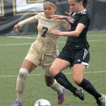 Keith Thorpe/Peninsula Daily News                                Peninsula&rsquo;s Hoku Afong, left, battles for the ball with Everett&rsquo;s Karin Heisen in the second half of the Pirates 1-0 win.