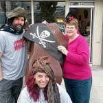 Downtown merchants Beau Damon Richards of Brocante, Elizabeth Morgan (center) of What&rsquo;s In Store and Barbara Frederick ofStage Right Vintage Outfitters are adding special coupons and in-store surprises as part of the Port Angeles Downtown Association&rsquo;s inaugural event &ldquo;Downtown Pirate Daze,&rdquo; to introduce PC students to the goods and services that are available downtown.