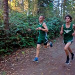 Rodger Johnson                                Port Angeles Sophomores AJ Fischer and Aron Trubow work together through the second mile of their cross country race at Robin Hill County Park.