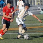 Keith Thorpe/Peninsula Daily News Peninsula&rsquo;s Salvador Vargas, right, keeps the ball away from Skagit Valley&rsquo;s Edgar Manzillas during the first half on Wednesday at Wally Sigmar Field in Port Angeles.