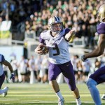 The Associated Press                                Washington quarterback Jake Browning (3) points upfield during the Huskies 70-21 win over Oregon. Browning had eight total touchdowns, six passing, two rushing.