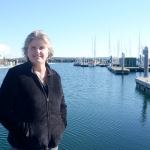 Port of Port Townsend executive director Sam Gibboney stands on the boat launch at the Port Townsend boat haven - one of the many Port properties that will benefit from the Port&rsquo;s 2017 capital projects plan. (Cydney McFarland/Peninsula Daily News)