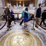 Senators walk through the rotunda and toward the House chamber to a joint session of the state Legislature in Olympia on March 18, 2015. (Elaine Thompson/The Associated Press)